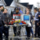 Rescue workers attempt to rush life-saving games and snacks to the boy.